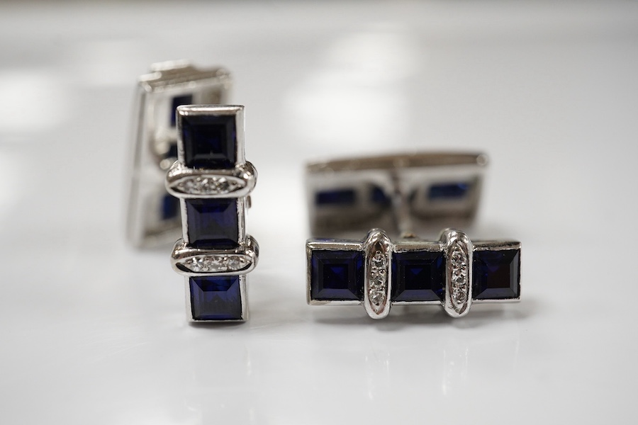 A pair of white metal, synthetic sapphire and diamond three row line cuff links, of curved rectangular form, 18mm, gross weight 16.6 grams. Condition - fair to good